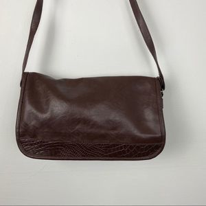 Purse over the shoulder color brown has no brand.